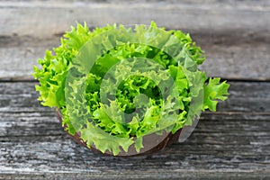 Fresh lettuce leaves in a bowl on the table