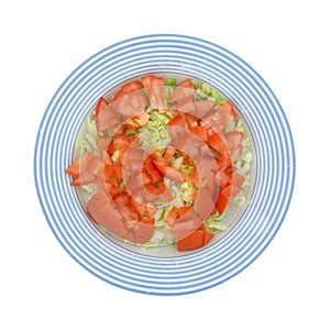 Fresh Lettuce And Tomato Salad In Blue Striped Bowl