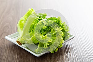 Fresh lettuce vegetable on a wooden table