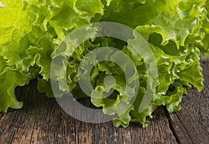Fresh lettuce on wooden background