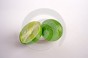 Fresh lime fruit cut with half