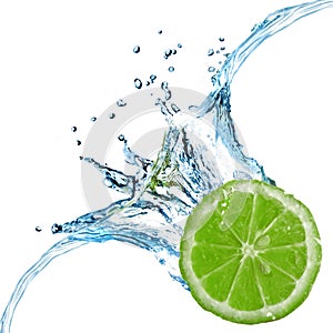 Fresh lime dropped into water with splash