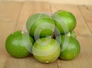 fresh lime fruit on wood background
