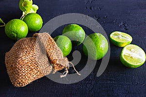 .Fresh Limes on a black background