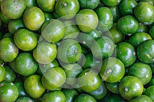 Fresh limes close up background. Healthy food. Harvest in the market, Thailand