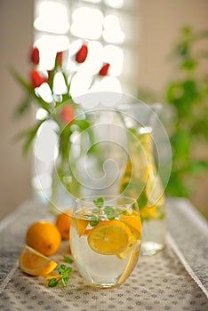 Fresh limes and lemonade on table photo