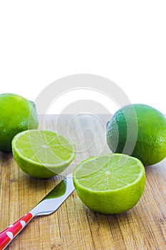 Fresh limes on wooden table