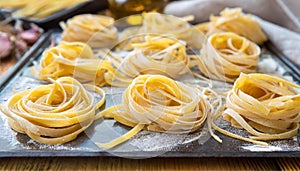 Fresh linguine pasta twirled on sheet pan