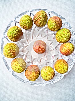 The fresh litchi  displayed circle in the plate photo