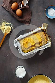 Fresh loaf cornbread dark background top view