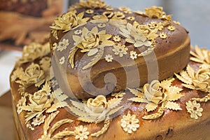 Fresh loaf with decoration in the form of flowers closeup