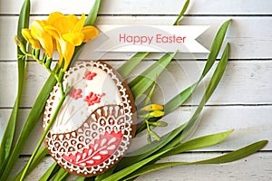 Fresh long grass frame a rustic wooden background, making perfect copyspace - Easter