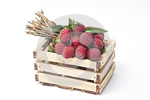 Fresh lychees in a wooden box