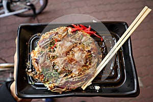 Fresh made japanese okonomiyaki as street food in Osaka