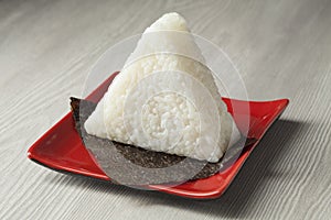 Fresh made Japanese triangular onigiri on seaweed