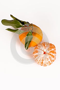 Fresh mandarin with leaf isolated on white