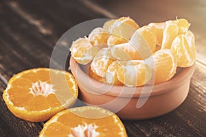 Fresh mandarin orange on wooden background