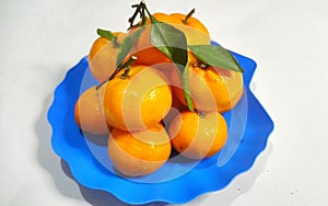 Fresh Mandarin Oranges or Shantang Oranges in a blue tray