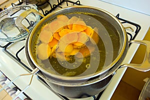 Fresh mango being scalded in preparation for dehydration