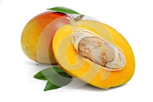 Fresh mango fruit with green leafs isolated