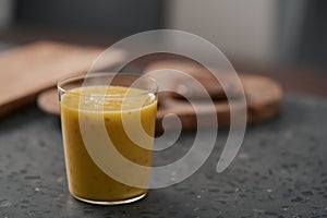 Fresh mango lulo smoothie on kitchen countertop