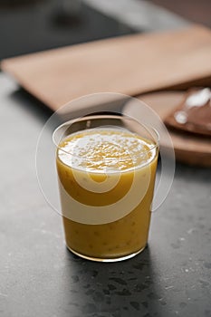 Fresh mango lulo smoothie on kitchen countertop