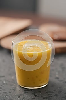 Fresh mango lulo smoothie on kitchen countertop