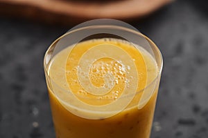 Fresh mango lulo smoothie on kitchen countertop