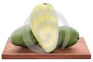 Fresh mango - Sliced green mangoes on wooden with isolated white