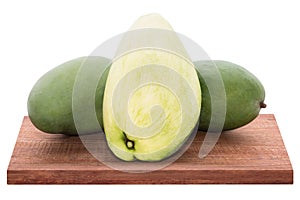 Fresh mango - Sliced green mangoes on wooden with isolated white