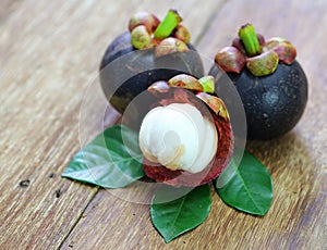 Fresh mangosteen fruit on wood