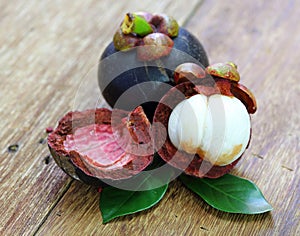 Fresh mangosteen fruit on wood