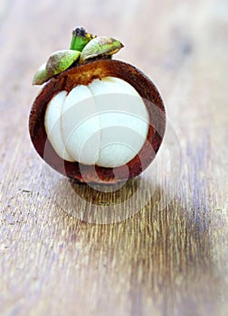 Fresh mangosteen fruit on wood