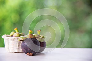 Fresh Mangosteen fruit on wood