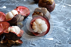 Fresh mangosteen fruits isolated on neutral background.