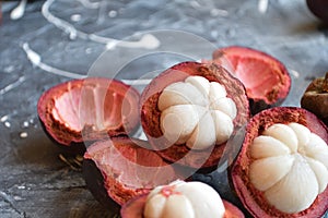 Fresh mangosteen fruits isolated on neutral background.