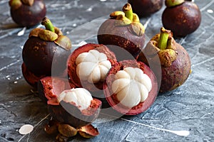 Fresh mangosteen fruits isolated on neutral background.