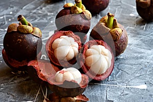 Fresh mangosteen fruits isolated on neutral background.