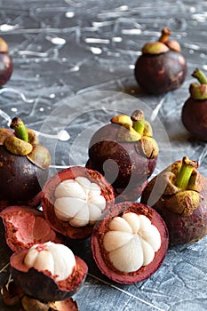 Fresh mangosteen fruits isolated on neutral background.