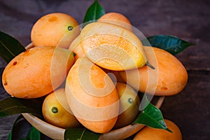 Fresh marian plum on wood background.