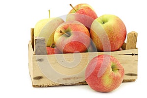 Fresh Maribelle apples in a wooden crate