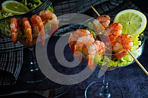 Fresh marine food Shrimp cocktail starter served in a tropical tourist restaurant in a glass with decoration of prawn with