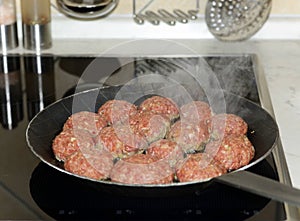 Fresh meat balls in a pan photo