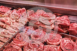 Fresh meat beef and pork sold on the counter at in refrigerator supermarket
