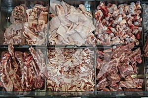 Fresh meat, lard, bones sold in a supermarket in Thailand . Meat background in store