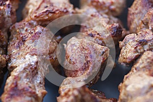 Fresh meat shish kebab fried and smoked on a charcoal grill.