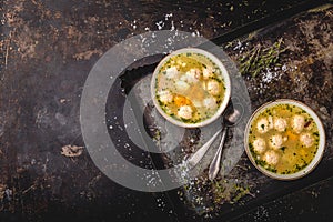 Fresh meat soup in bowl on dark background