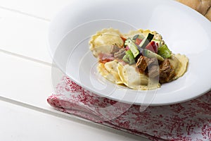 Fresh meat tortellini with tomato and sauteed vegetables