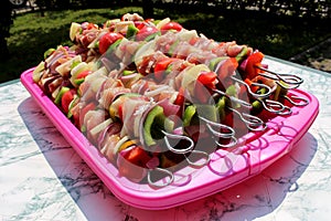 Fresh meat and vegetable kebabs prepared for grilling