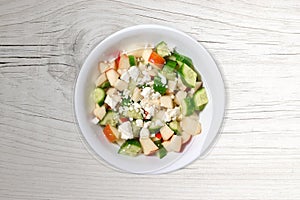 Fresh Meditteranean Salad on Contemporary White Wood Background